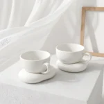 Σετ κούπες New Bone China με πορσελάνινα πιατάκια σε σχήμα βότσαλου
